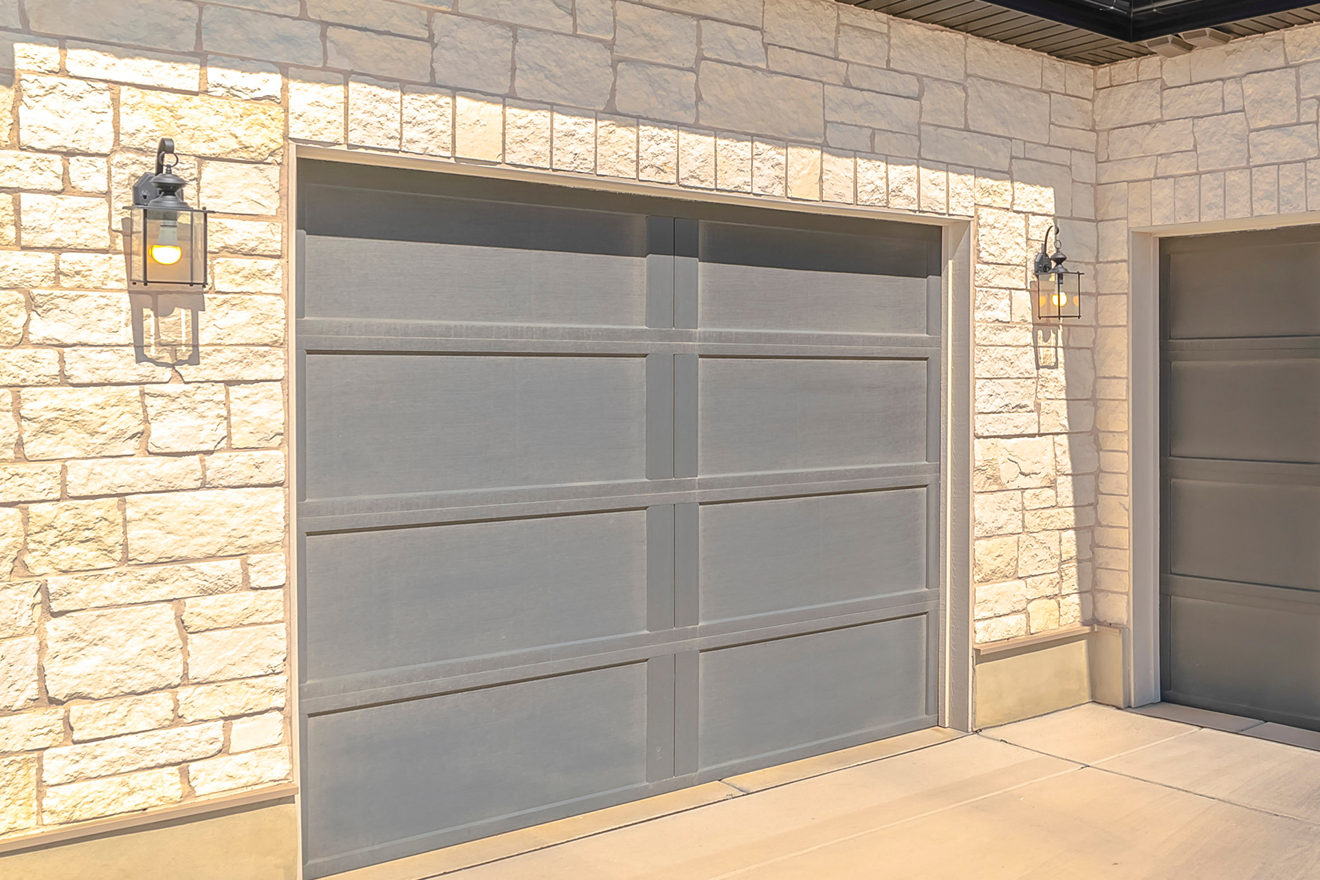 Close-up view of the steel garage door panel texture and color